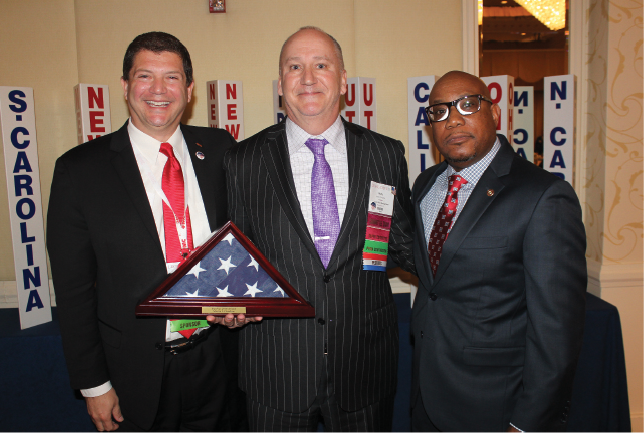 FMC’s Steve Fasano (left) and Arnold Ramsey (right) with PestVets Veteran of the Year Marty Overline (center).
