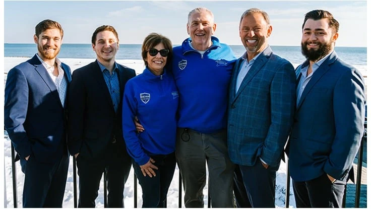 Pictured left to right in the photo: Chris Aust, Dan Aust, Mary Ann Lipsett, Michael Lipsett, Stuart Aust, and Nick Aust.