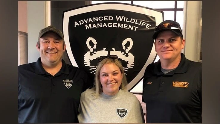 Pictured (left to right): Chris and Sara O'Banion, owners of Advanced Wildlife Management, and Jared Miller of Varment Guard.