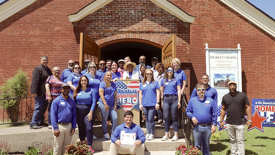 Mary Harris posing with the All-American team.