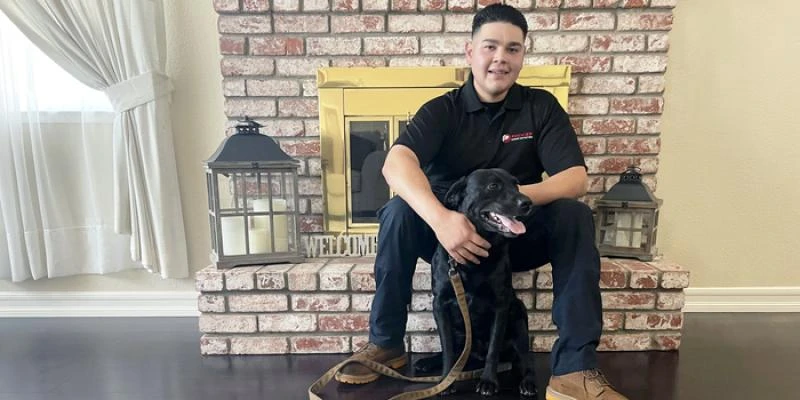 Jordan Garcia, and his dog Raider.