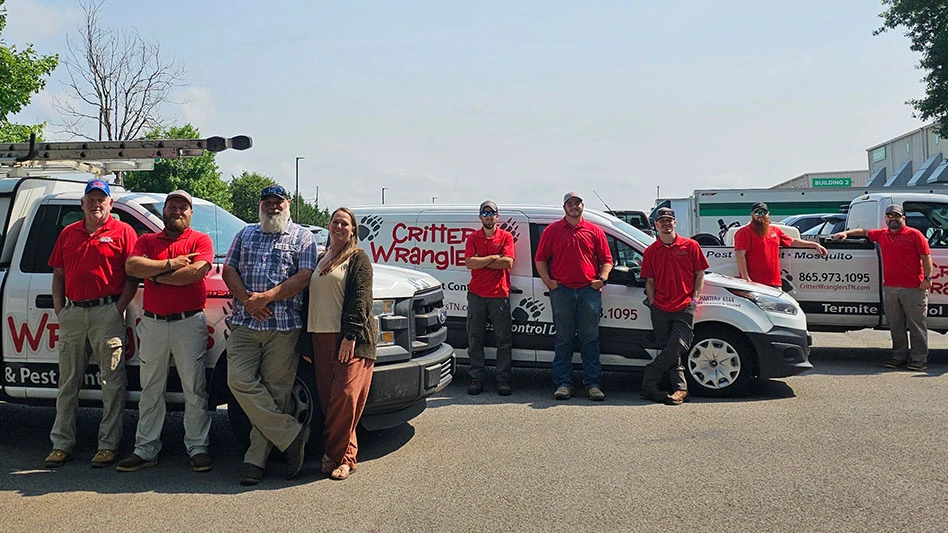 Matt and wife Crystal Chitwood (third and fourth from left) and the Critter Wranglers team.