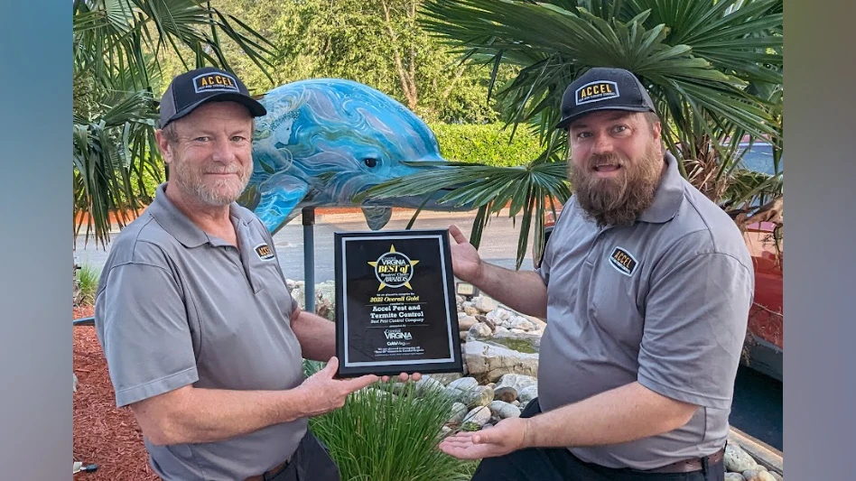 Photo of Accel Pest and Termite Control employees with their award.