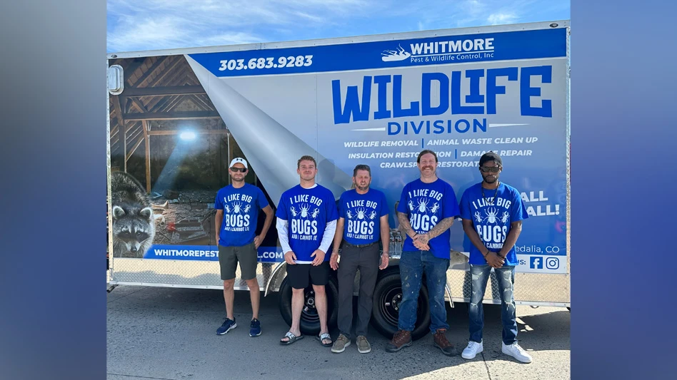 Photo of Whitmore Pest and Wildlife Control employees that participated in the parade.