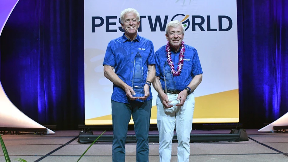 Alfie (left) and Larry (right) Treleven accepting the NPMA Pinnacle Award in Hawaii.