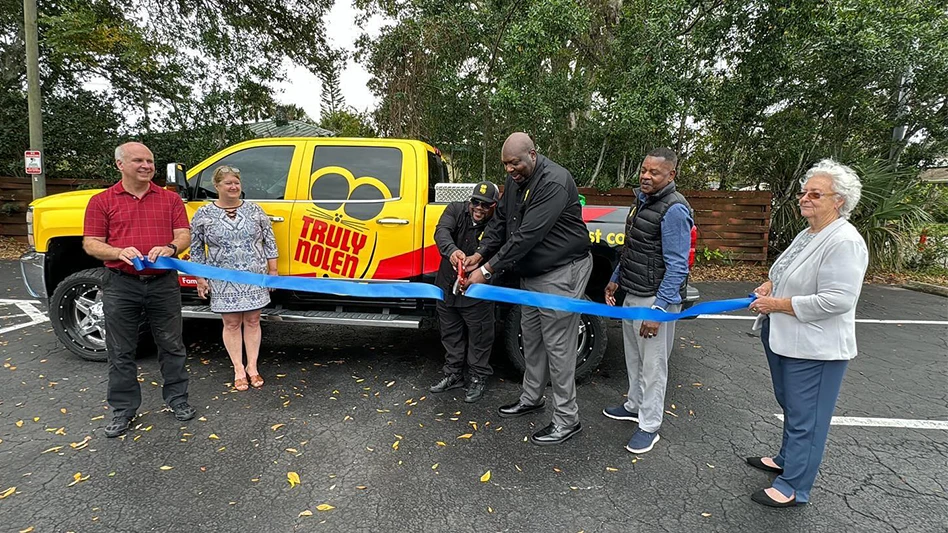 The moment Terrance Parker (left) and Terrell Rainey (right) cut the ribbon with Lance Washington (right of Rainey) looking on and three Daytona Beach Ambassadors on-hand holding the ribbon.