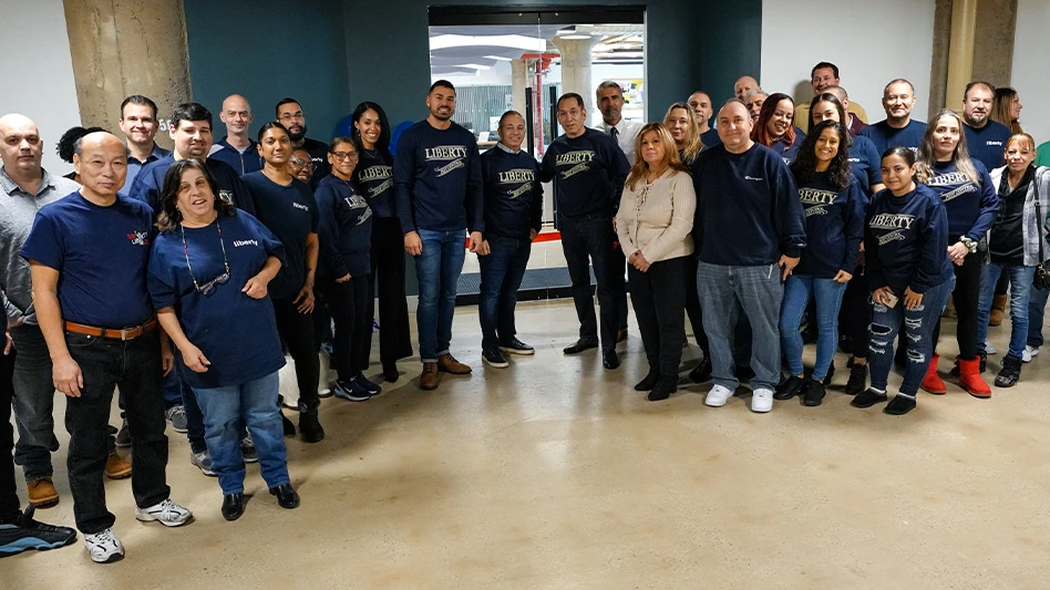 Liberty Pest Control employees in front of the company's new office and warehouse.