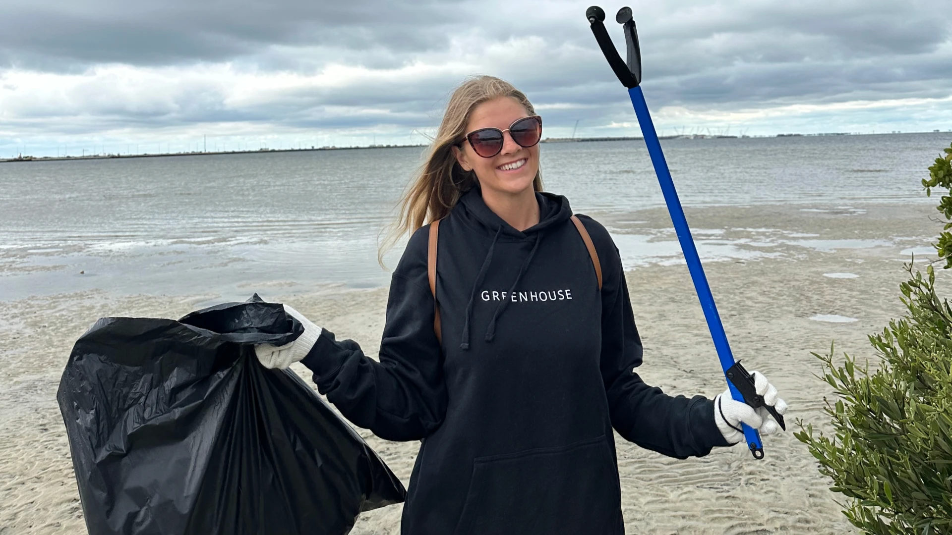 A member of the team cleaning up Cypress Point Park beach in Tampa, Fla.