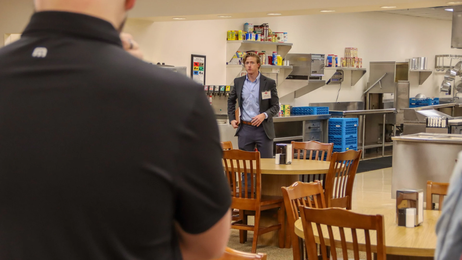 Pictured: Rollins' Hayden Holmes giving a tour of the commercial training kitchen.