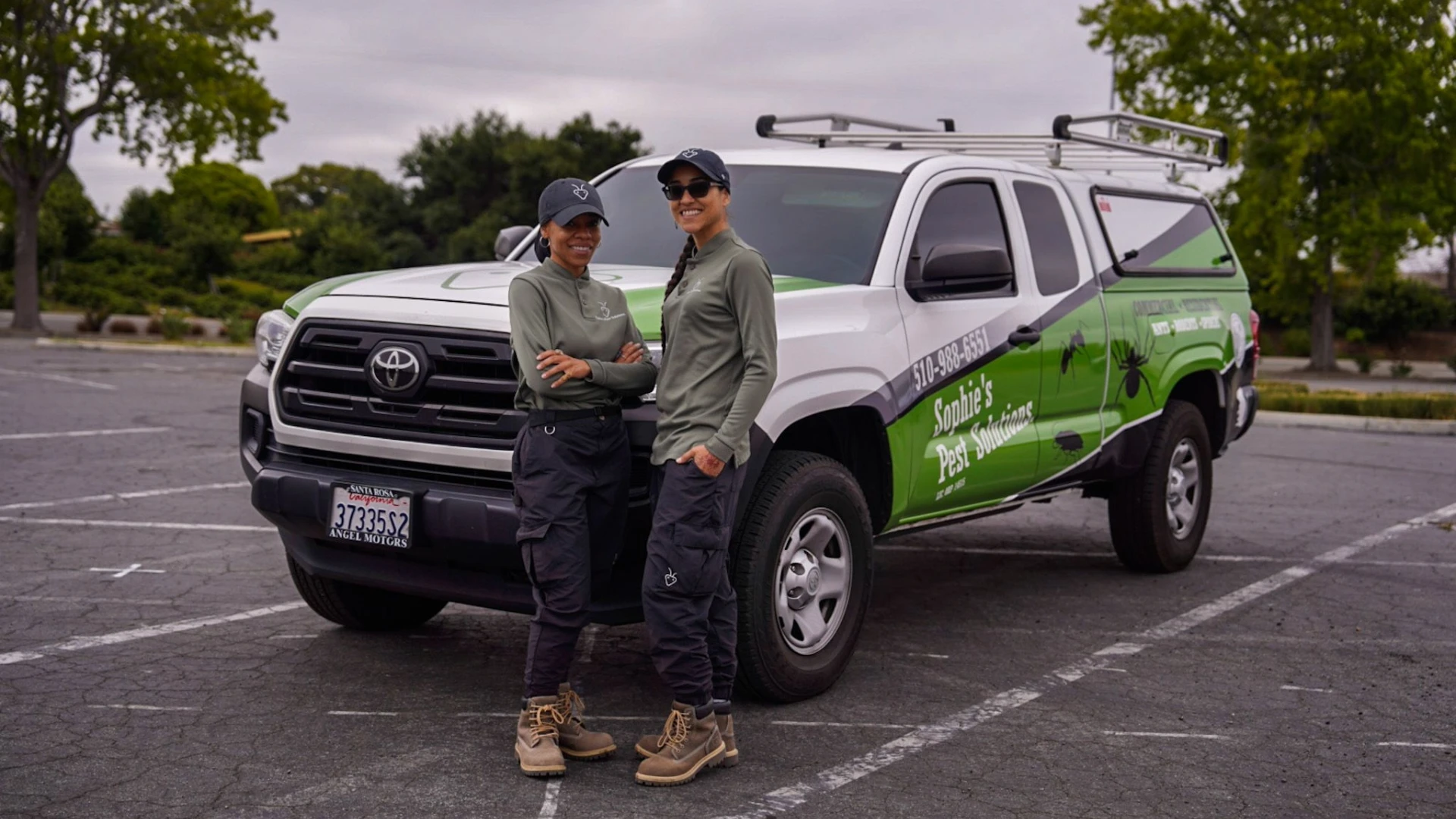 Pictured: Sophia Rodriguez (left) and her wife, La Quisha Simms, in front of their newly wrapped service vehicle.